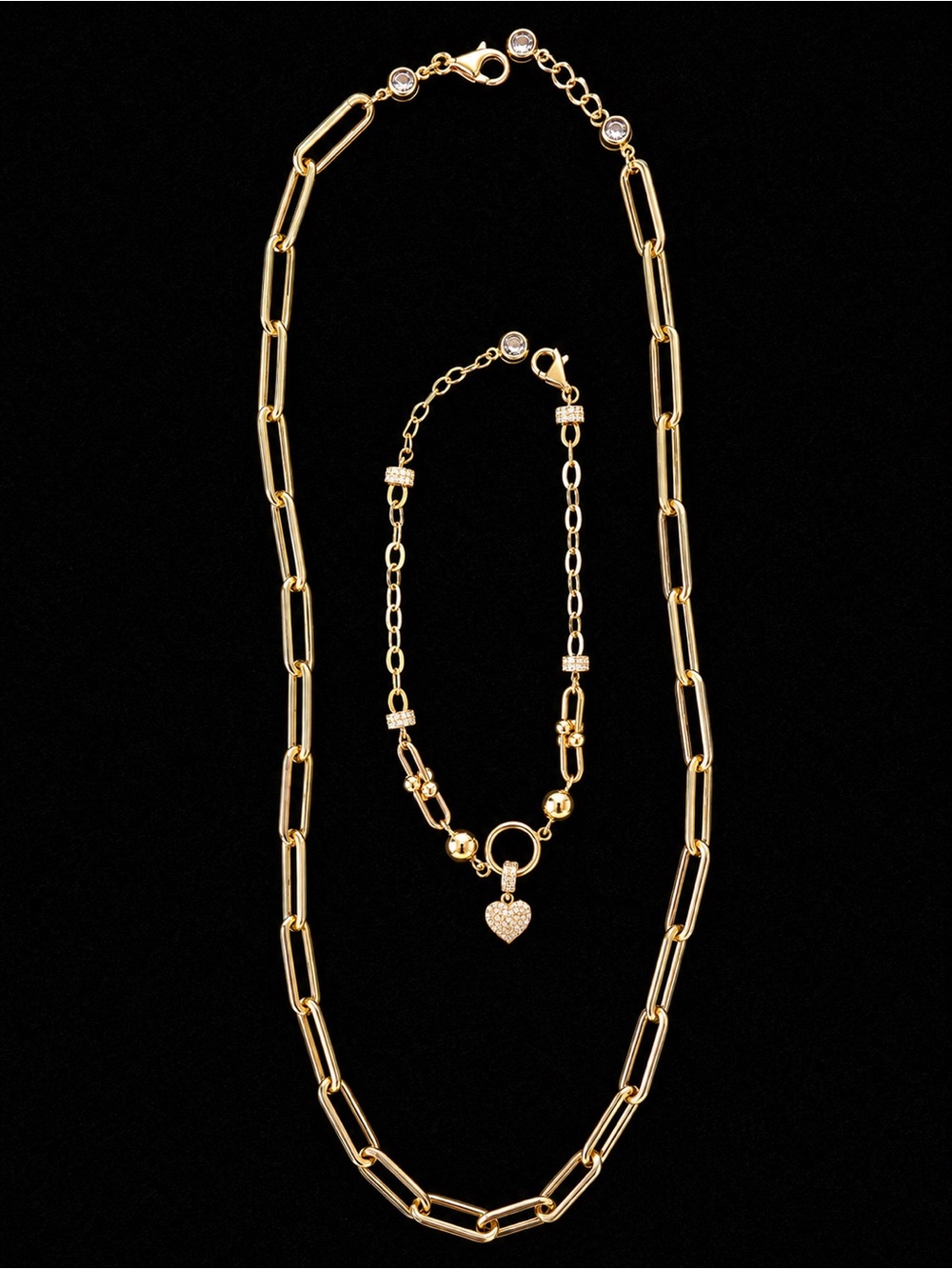 14kt gold paperclip necklace and matching 14 kt gold bracelet with pave diamond